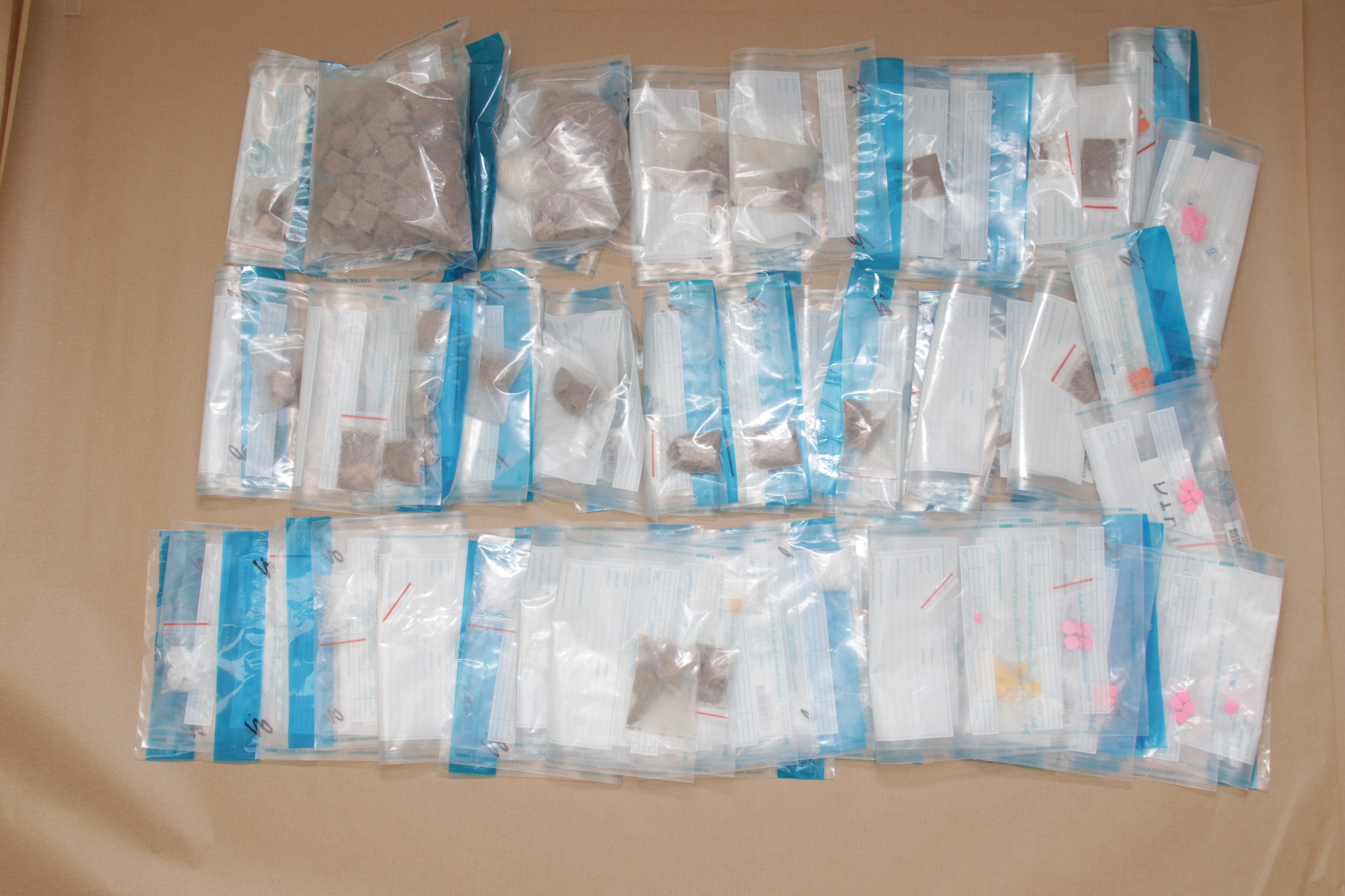 Bags of substances, on a cardboard surface